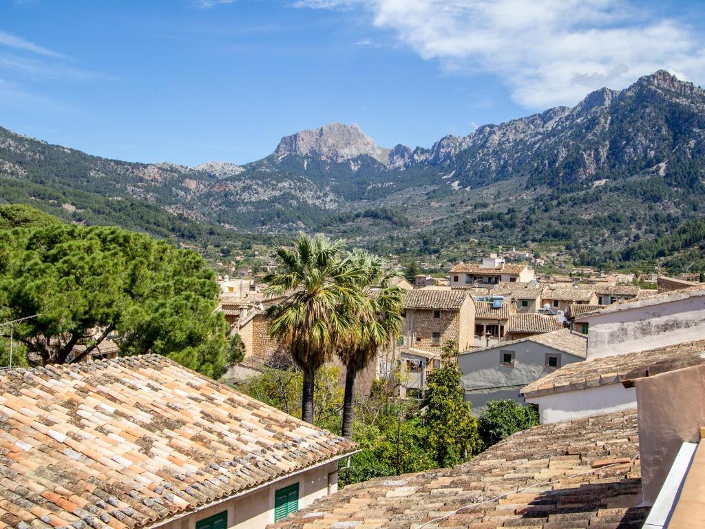 a view of a town with mountains in the background at Ca'n Abril in Sóller