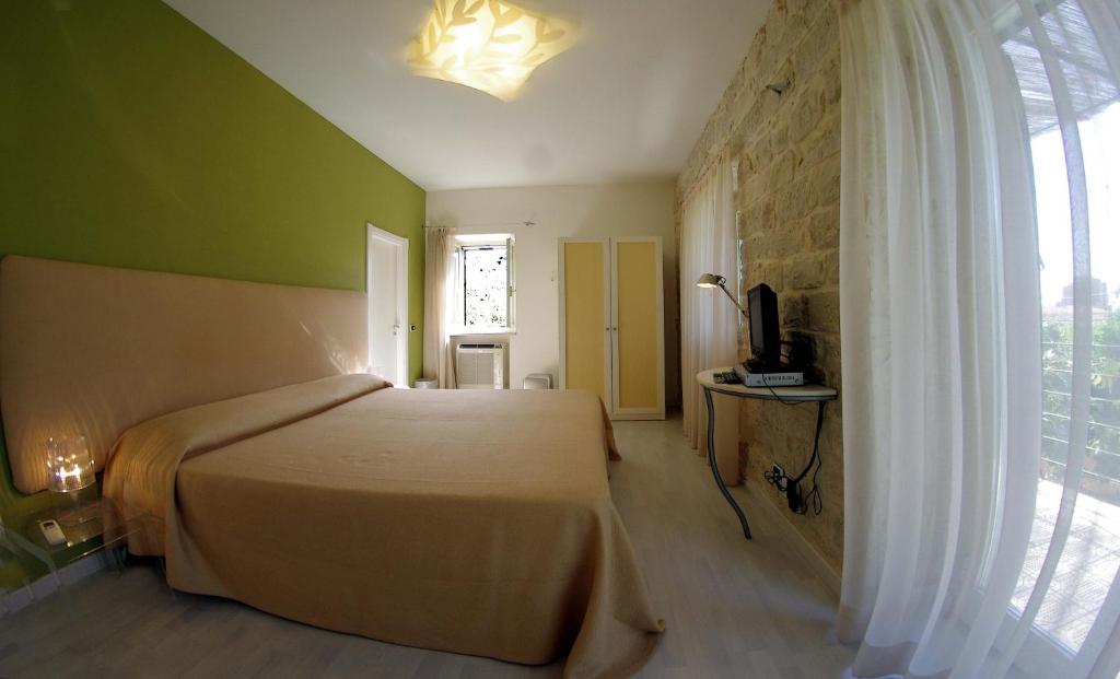 Postel nebo postele na pokoji v ubytování La Piccola Locanda