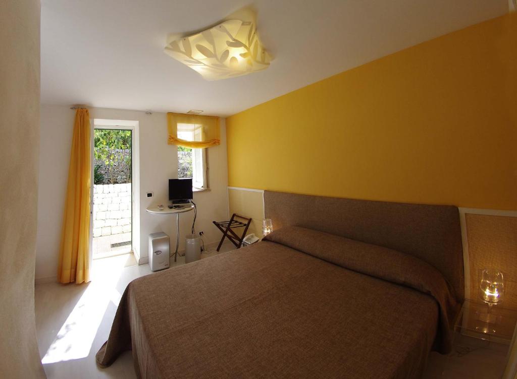 Postel nebo postele na pokoji v ubytování La Piccola Locanda