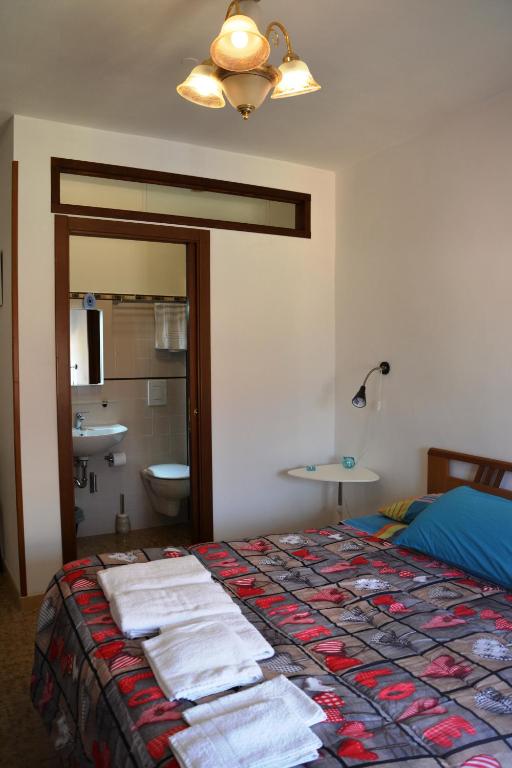 Postel nebo postele na pokoji v ubytování B&B CASA CRISTALLO