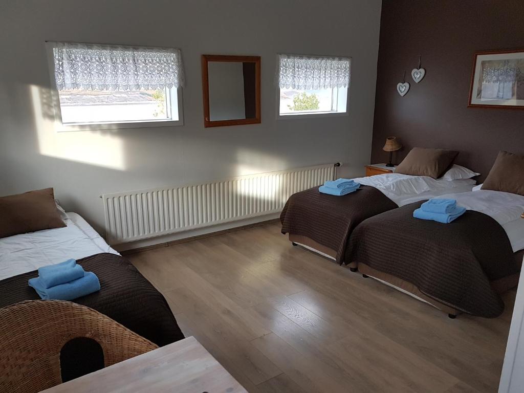 Postel nebo postele na pokoji v ubytování Lamb Inn Öngulsstadir