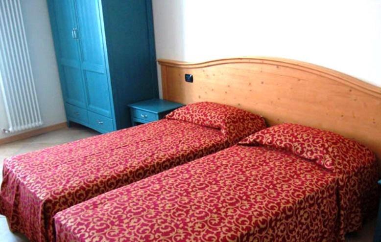 Postel nebo postele na pokoji v ubytování Residence Centrale