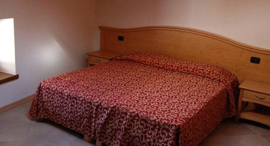 Postel nebo postele na pokoji v ubytování Residence Centrale