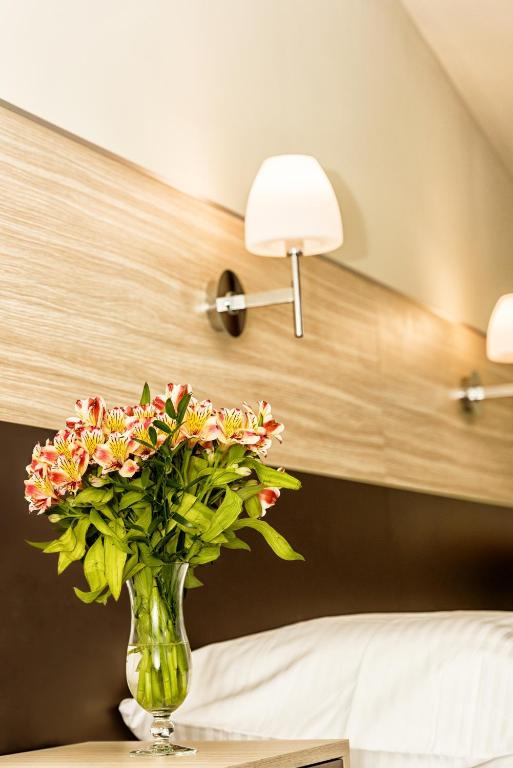 Posteľ alebo postele v izbe v ubytovaní Hotel Kazimierz III
