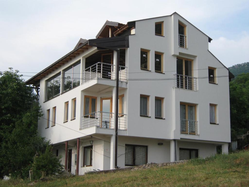a white building on top of a hill at Apartments Taneski in Ohrid