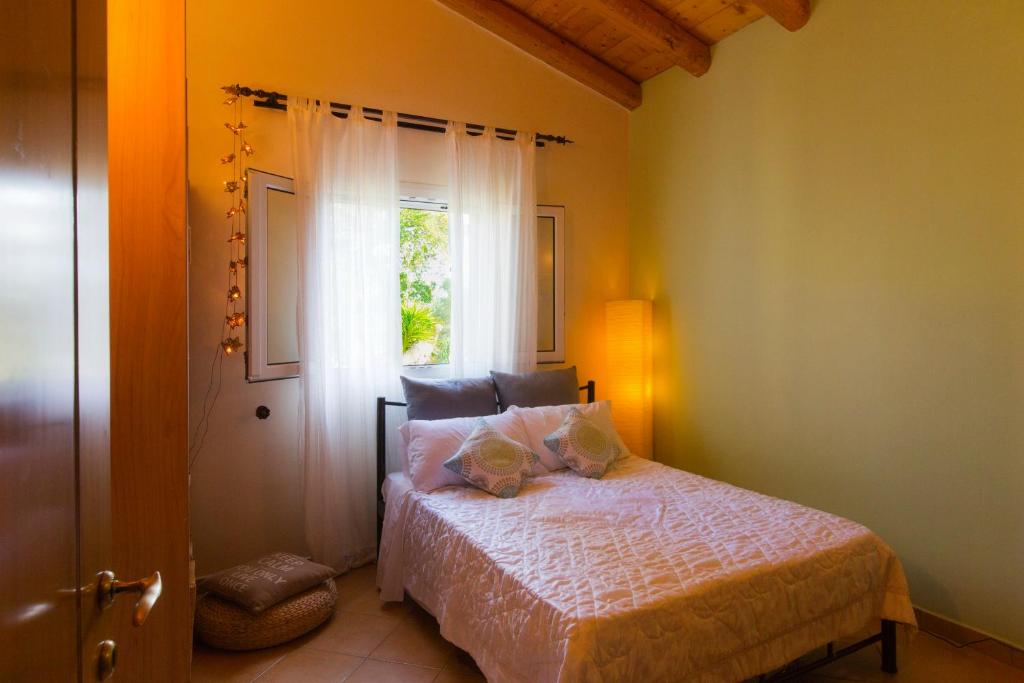 Postel nebo postele na pokoji v ubytování Villa Caramel