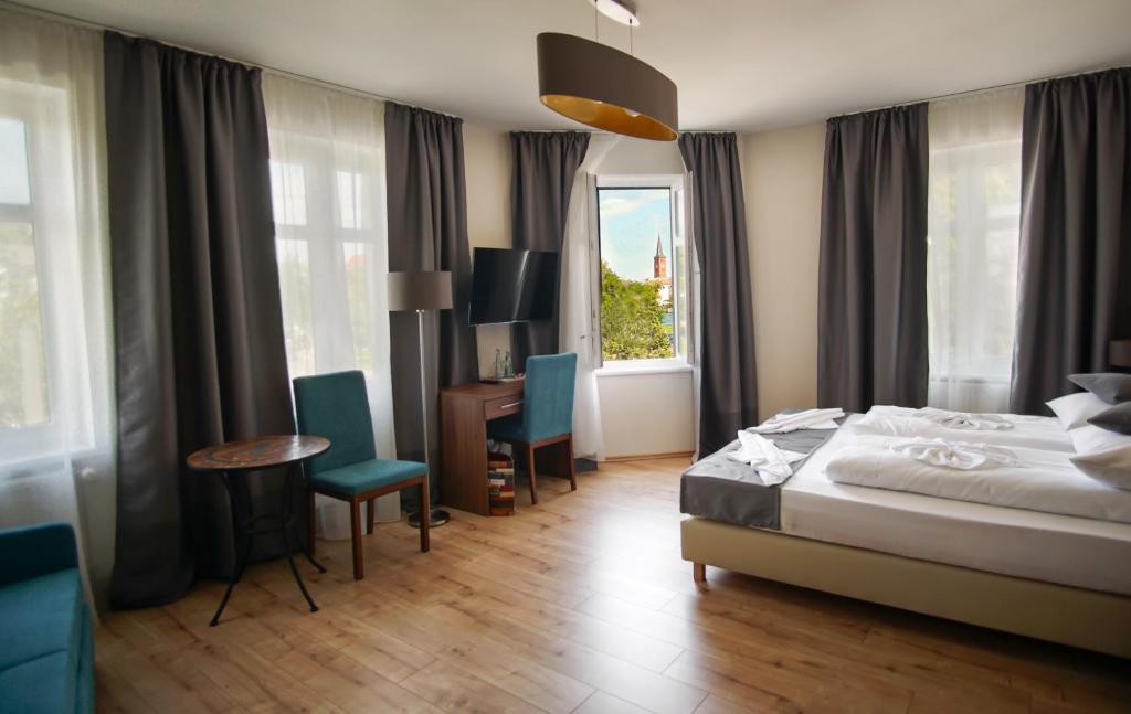 Postel nebo postele na pokoji v ubytování Hotel Bett und Buch