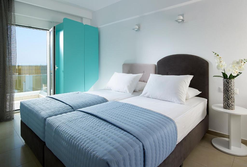 Posteľ alebo postele v izbe v ubytovaní Coral Hotel