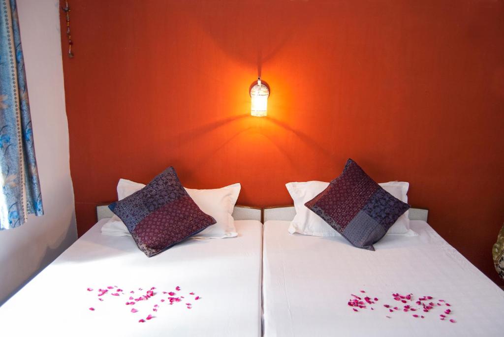 Postel nebo postele na pokoji v ubytování Hotel Rising Star