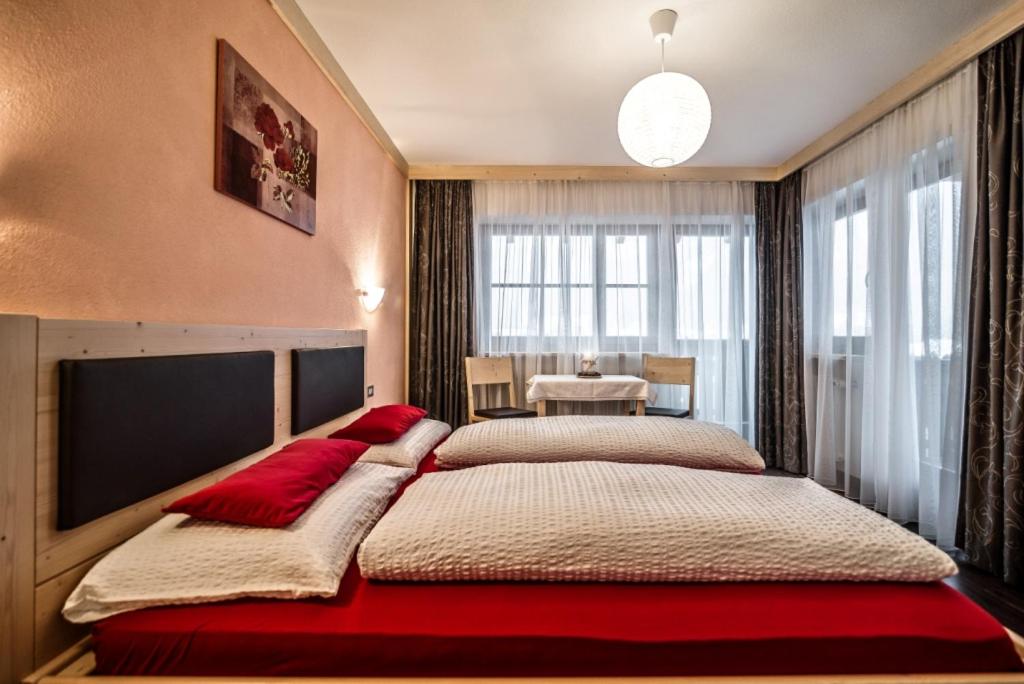 Postel nebo postele na pokoji v ubytování Ciasa Confolia