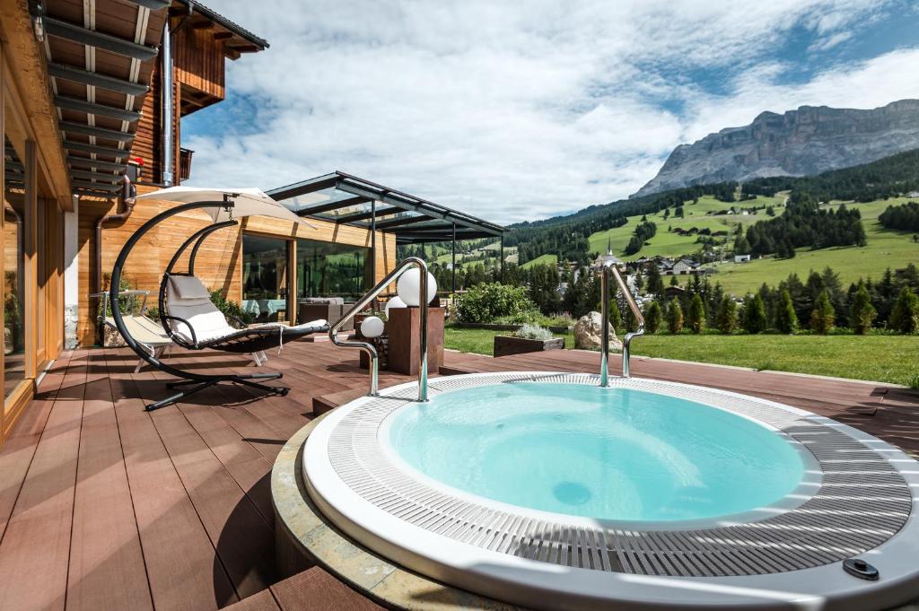 a hot tub on the patio of a house at Gourmet Hotel Gran Ander in Badia