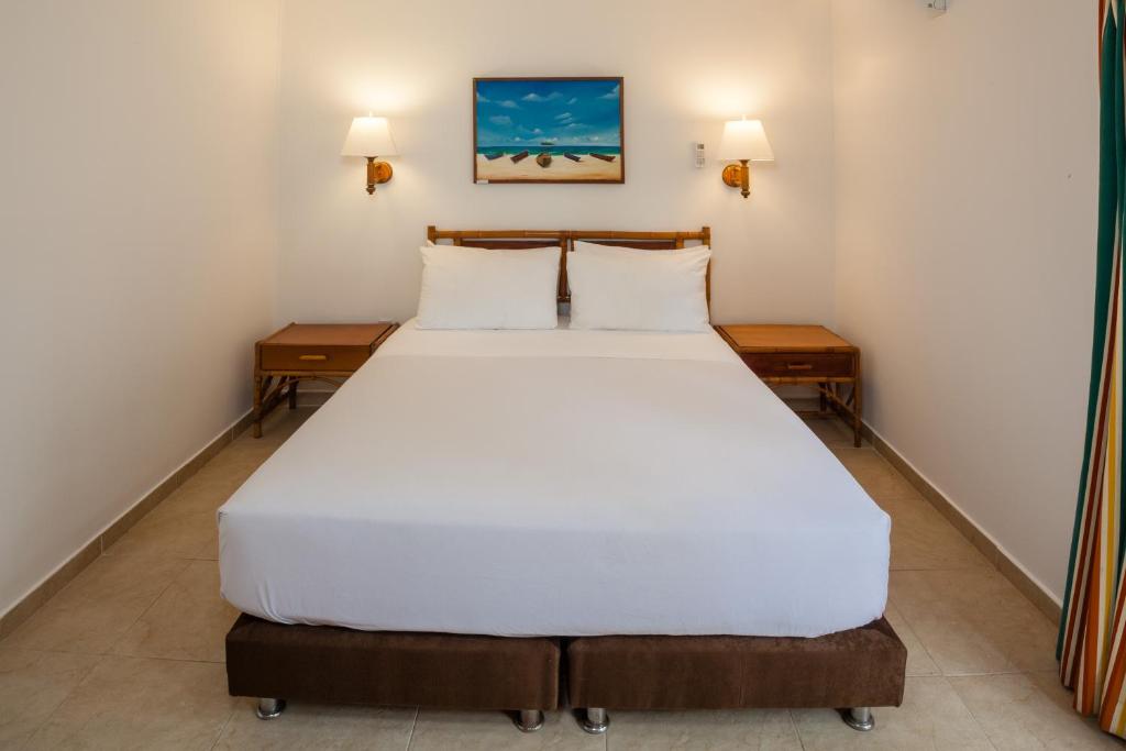 Postel nebo postele na pokoji v ubytování Decameron San Luis - All Inclusive