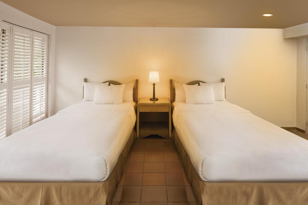 Postel nebo postele na pokoji v ubytování Decameron Aquarium - All Inclusive