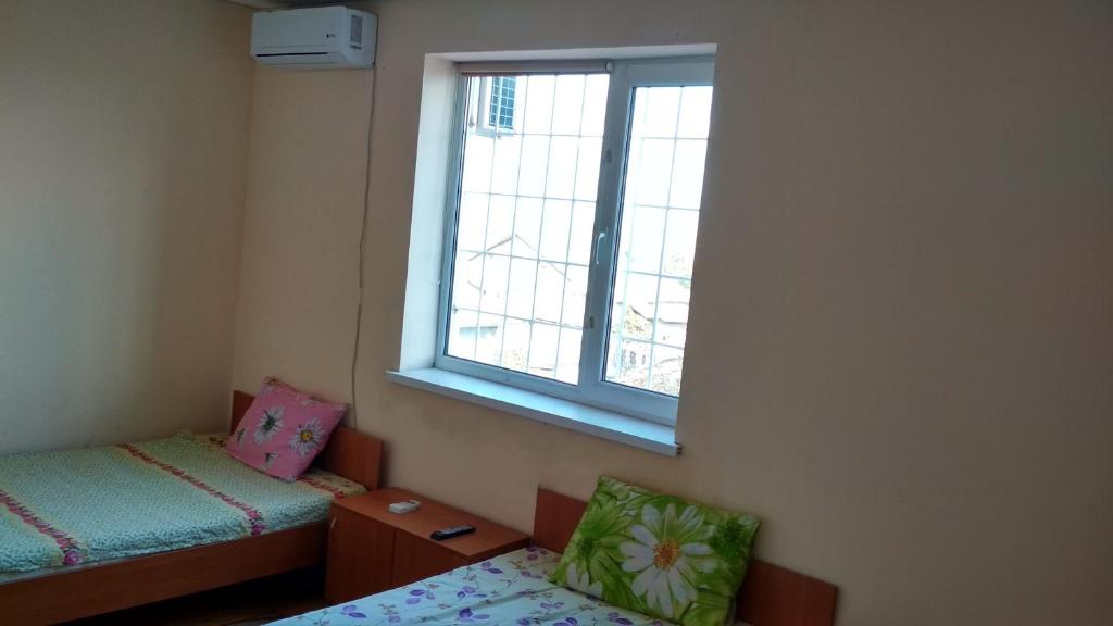 Postel nebo postele na pokoji v ubytování Hotel Uyut
