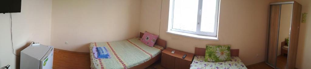 Postel nebo postele na pokoji v ubytování Hotel Uyut