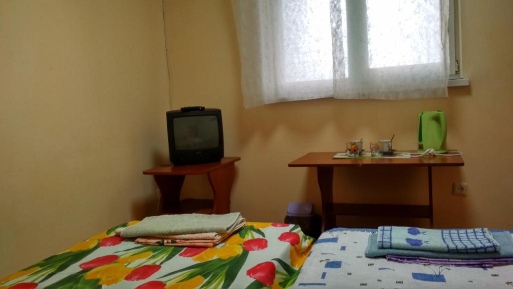 Postel nebo postele na pokoji v ubytování Hotel Uyut