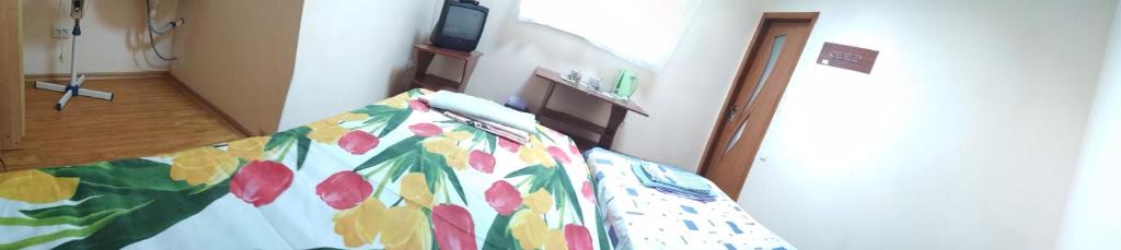 Postel nebo postele na pokoji v ubytování Hotel Uyut