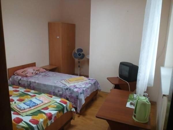 Postel nebo postele na pokoji v ubytování Hotel Uyut
