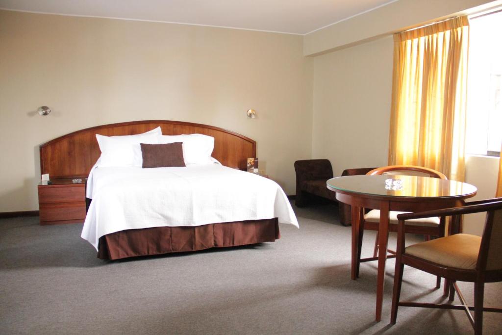 Postel nebo postele na pokoji v ubytování Hotel Park Suites