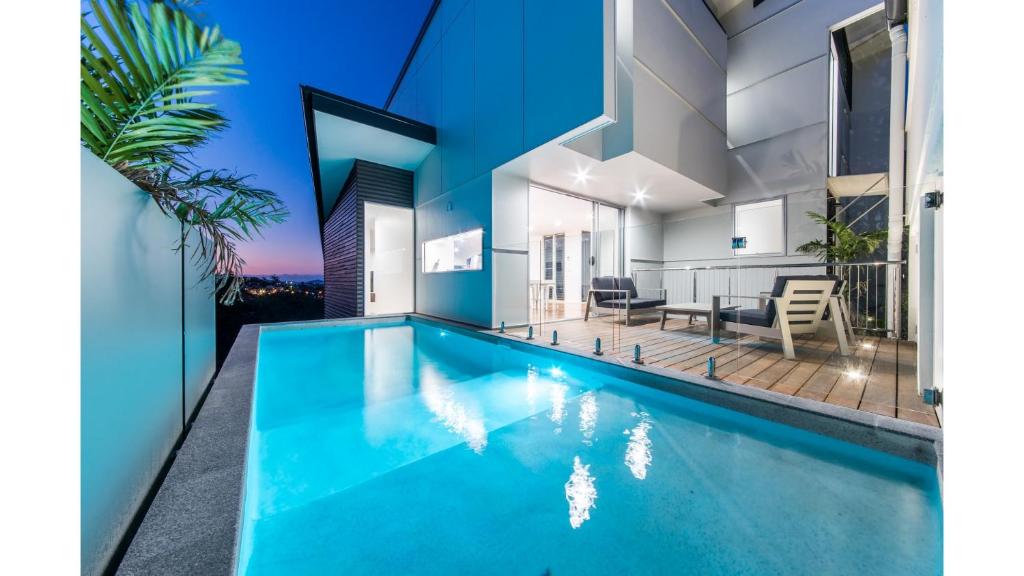 an image of a swimming pool in a house at Oleander Holiday Home - Airlie Beach in Airlie Beach