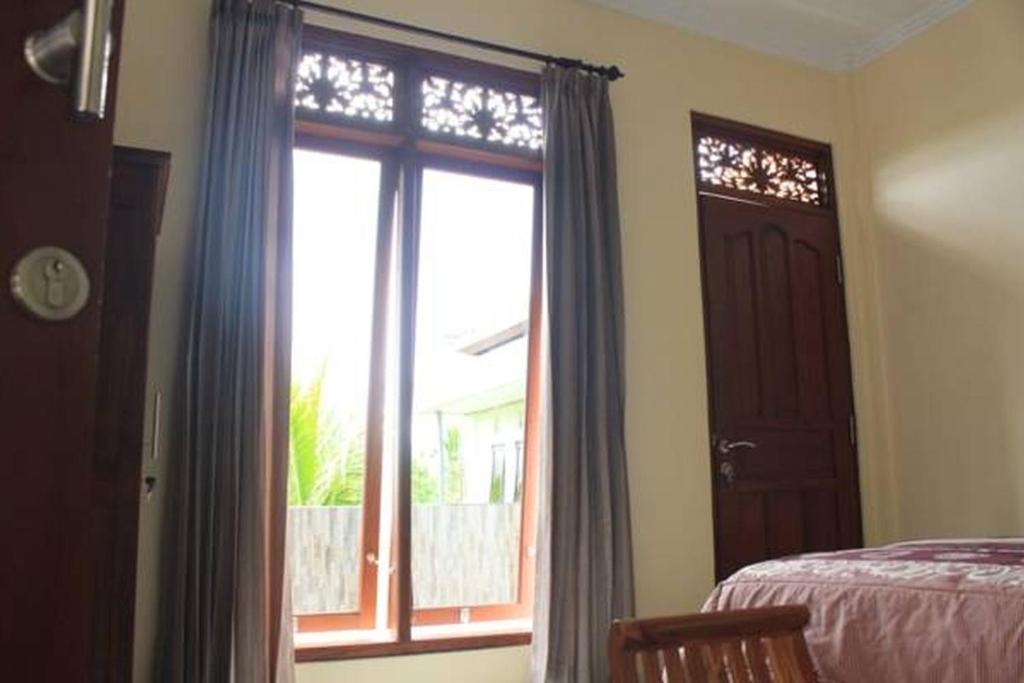 Postel nebo postele na pokoji v ubytování Lucky Family Villa