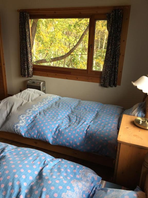 Tempat tidur dalam kamar di Ohisama House