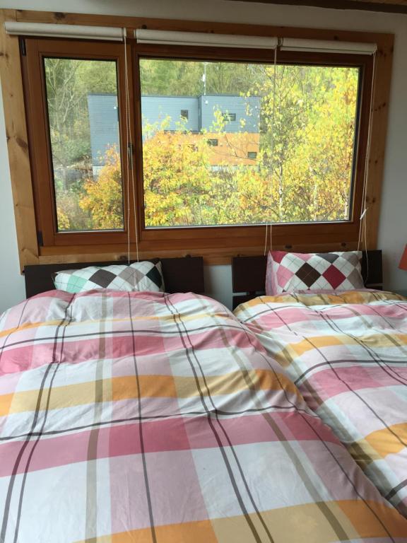 Tempat tidur dalam kamar di Ohisama House