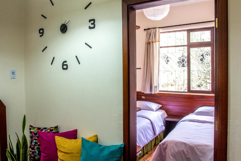 Postel nebo postele na pokoji v ubytování El Patio Hostel Quito