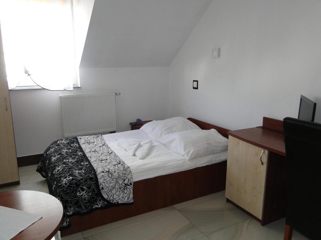 Łóżko lub łóżka w pokoju w obiekcie Hotel Agat & SPA