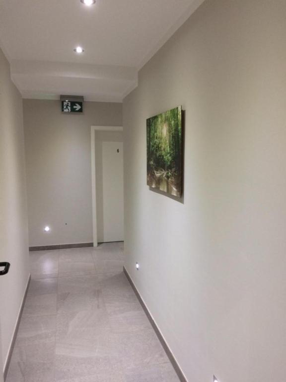 an empty room with a painting on the wall at Bergcafè - Hotel Kammann in Essen