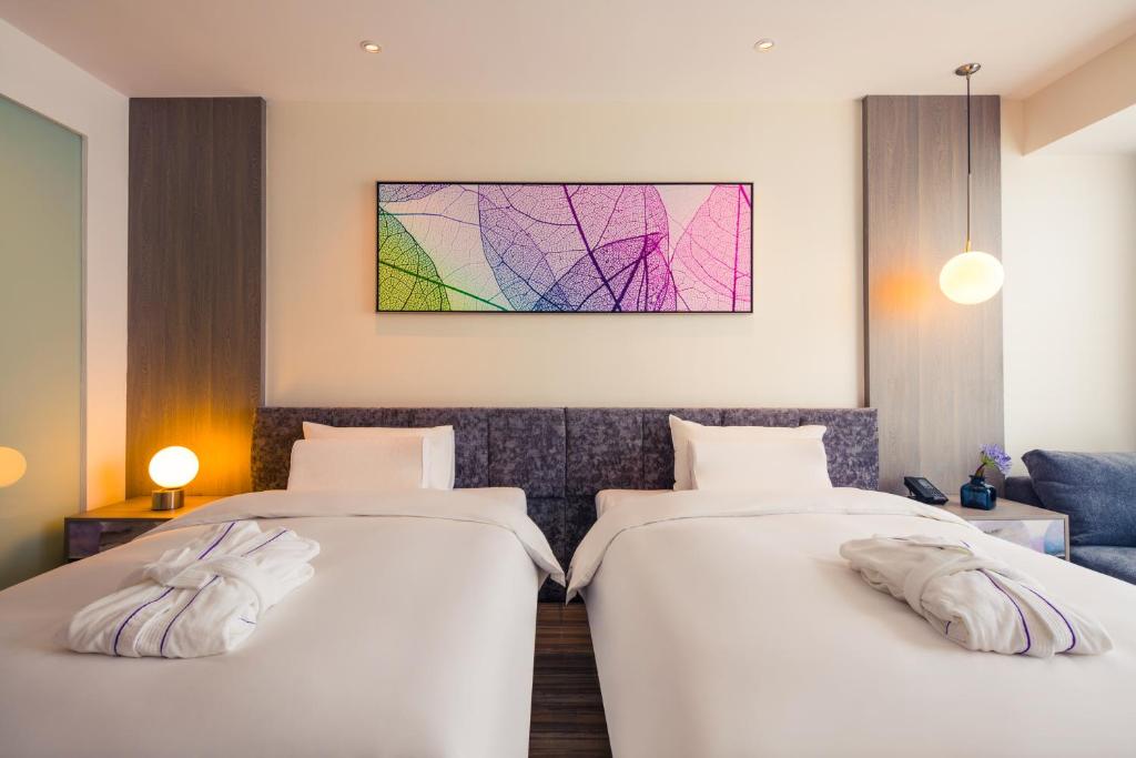 Postel nebo postele na pokoji v ubytování Mercure Shanghai Hongqiao South