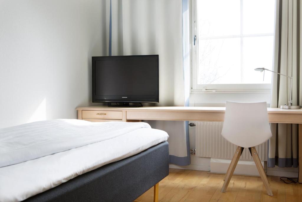 TV a/nebo společenská místnost v ubytování Comfort Hotel Arctic