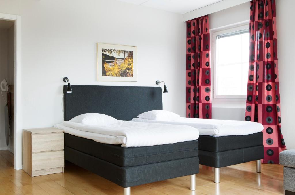 Ένα ή περισσότερα κρεβάτια σε δωμάτιο στο Comfort Hotel Arctic