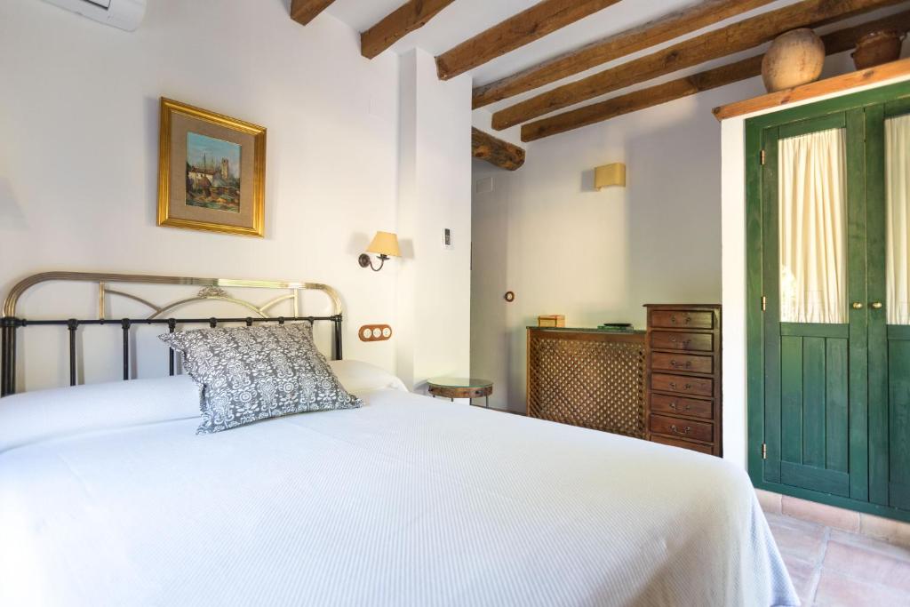 Postel nebo postele na pokoji v ubytování CALERILLA Hotel