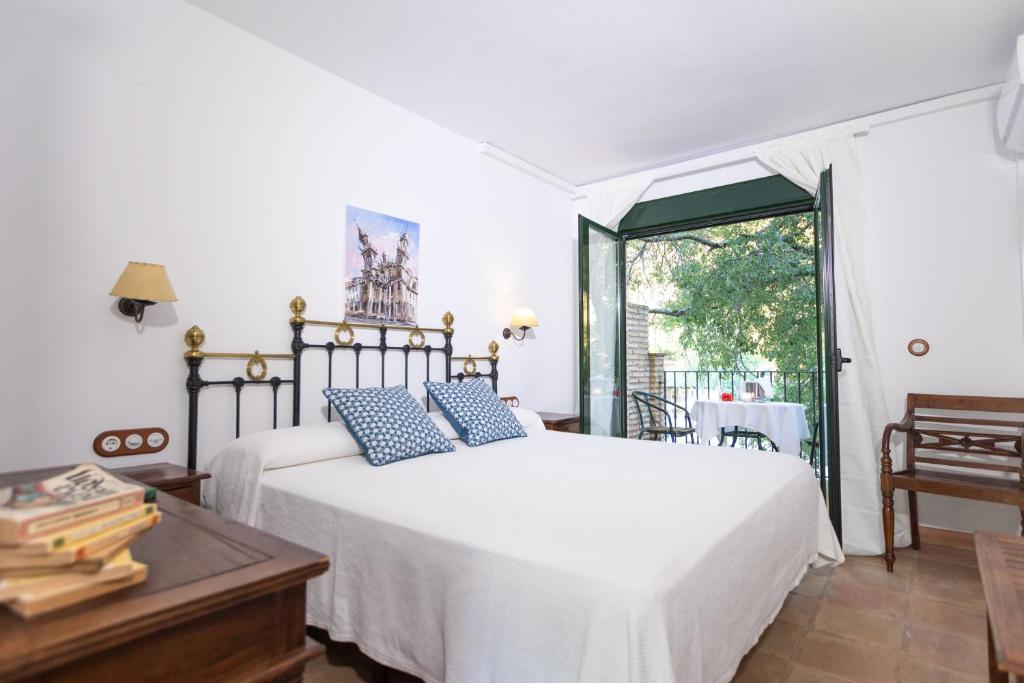 Postel nebo postele na pokoji v ubytování CALERILLA Hotel