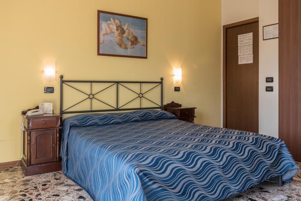 Postel nebo postele na pokoji v ubytování Albergo Carpino