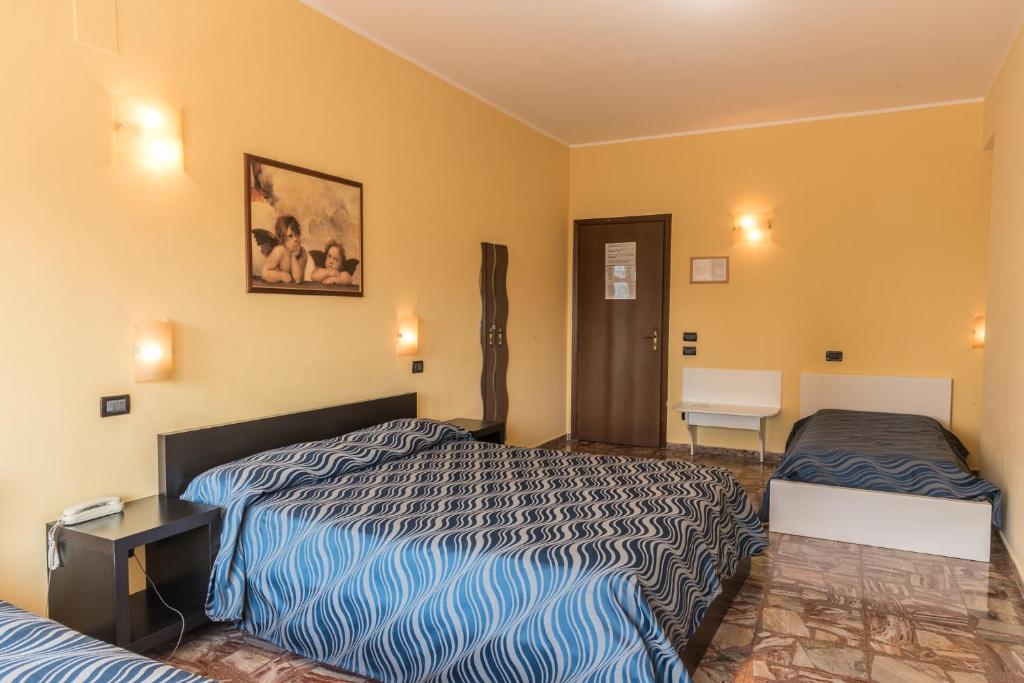 Postel nebo postele na pokoji v ubytování Albergo Carpino