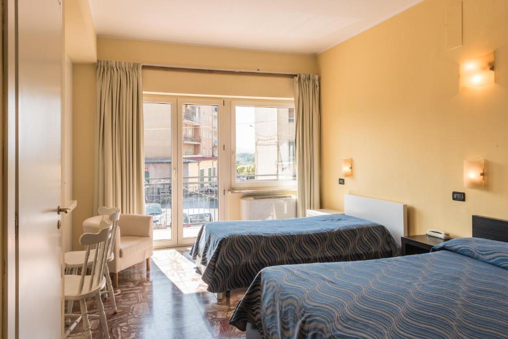Postel nebo postele na pokoji v ubytování Albergo Carpino