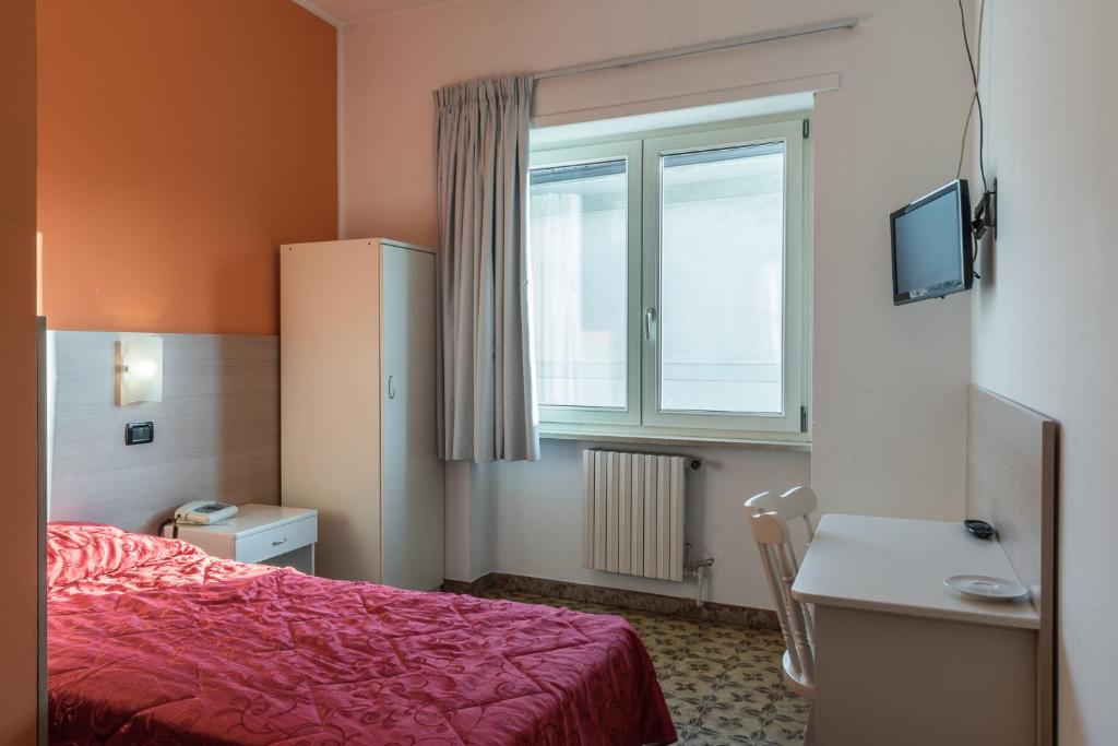Postel nebo postele na pokoji v ubytování Albergo Carpino