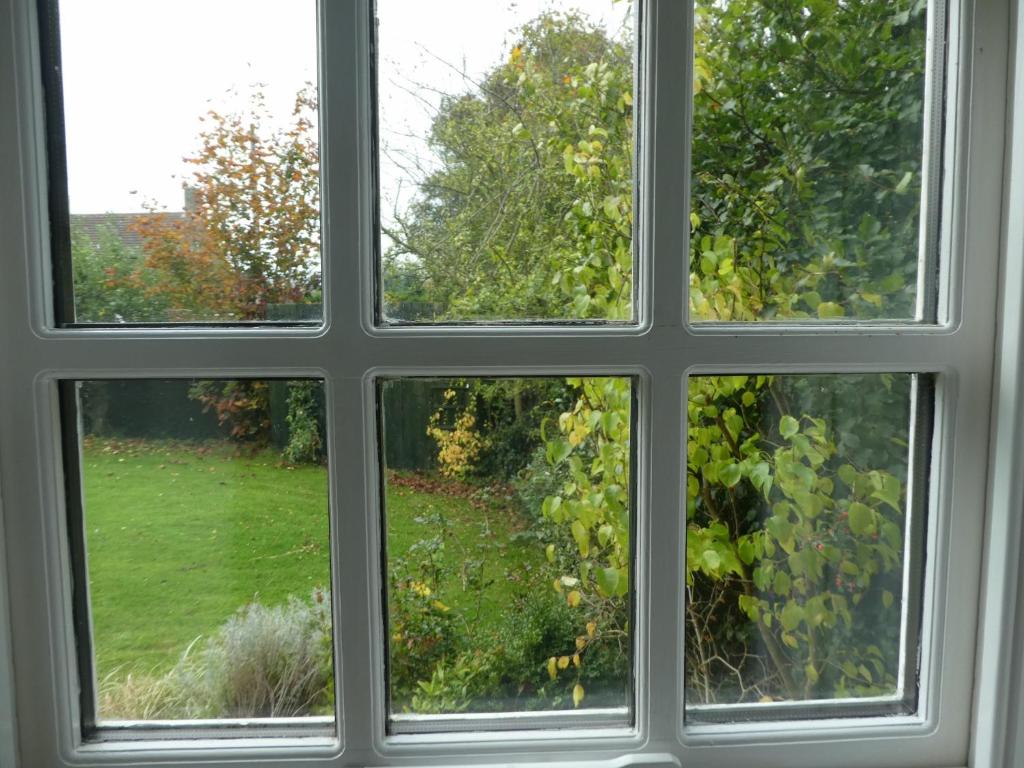 a window with a view of a garden outside at West View Farm in Louth