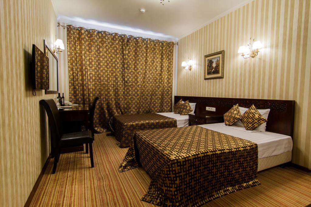 Postel nebo postele na pokoji v ubytování Klassik Hotel
