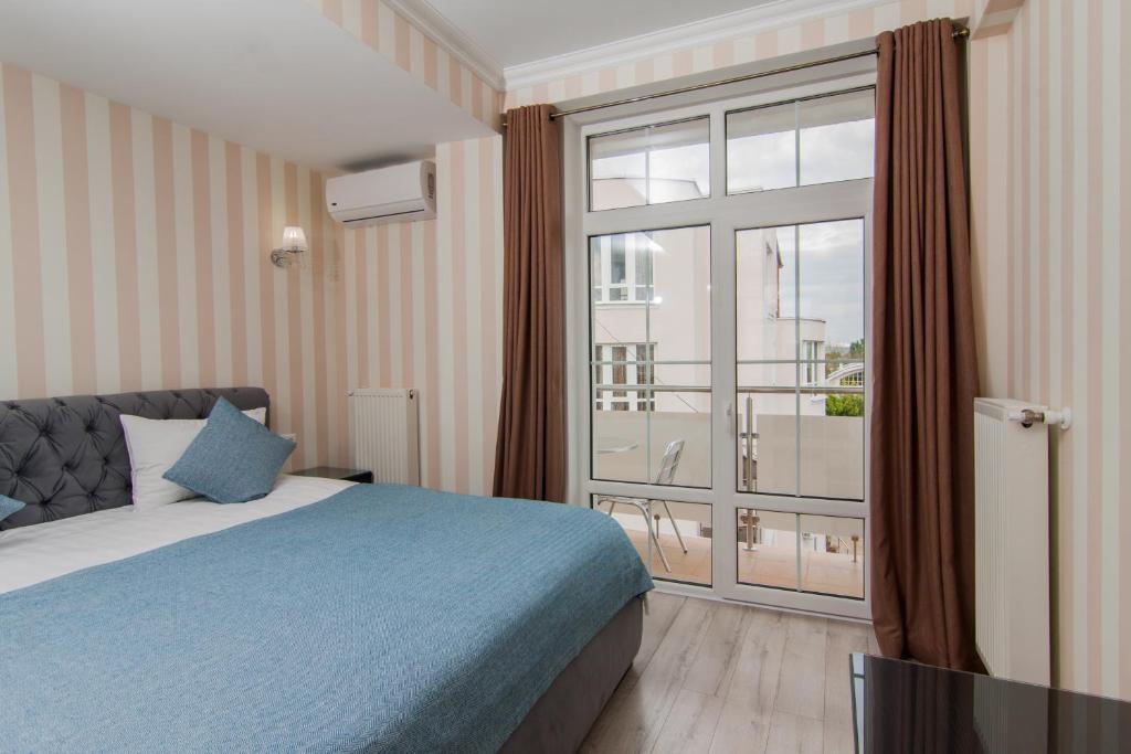 Postel nebo postele na pokoji v ubytování Klassik Hotel