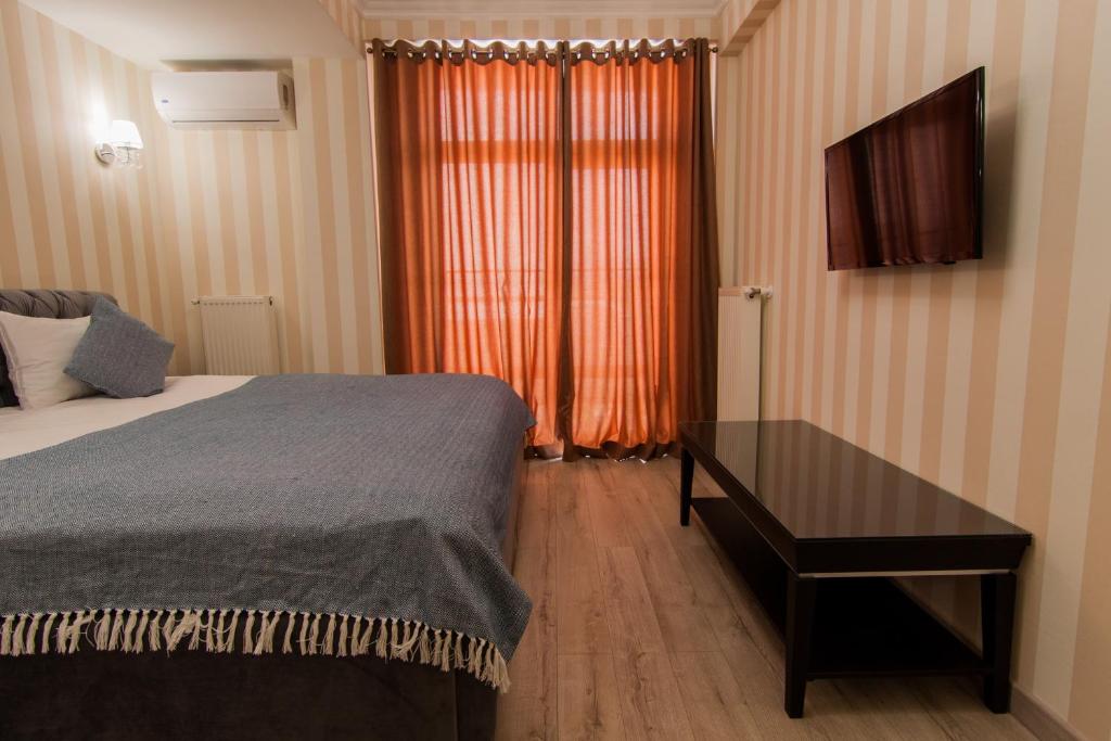 Postel nebo postele na pokoji v ubytování Klassik Hotel