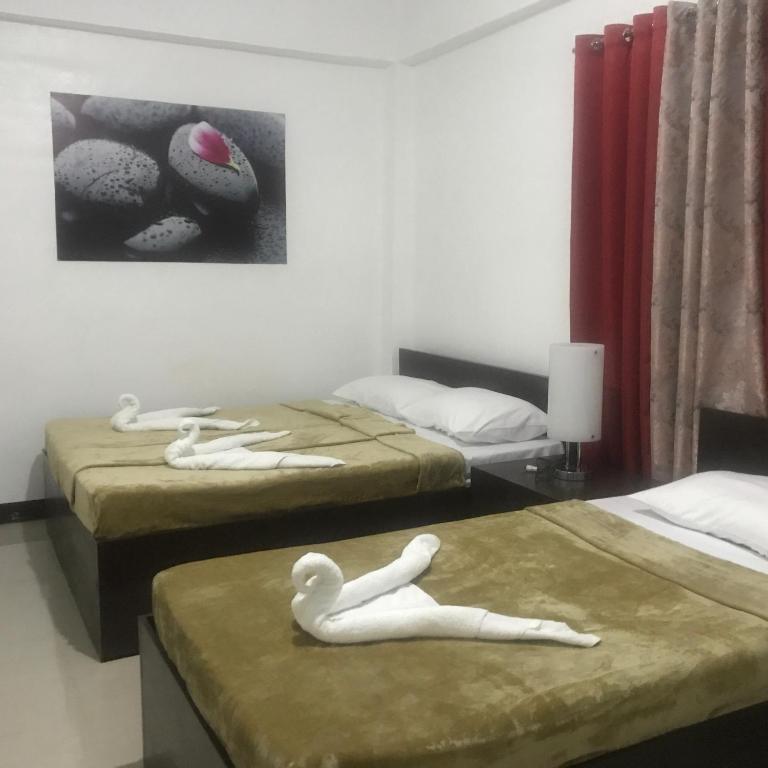 Postel nebo postele na pokoji v ubytování 4C's Tourist Lodge
