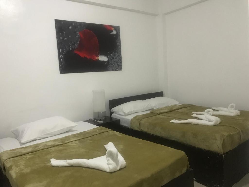 Postel nebo postele na pokoji v ubytování 4C's Tourist Lodge