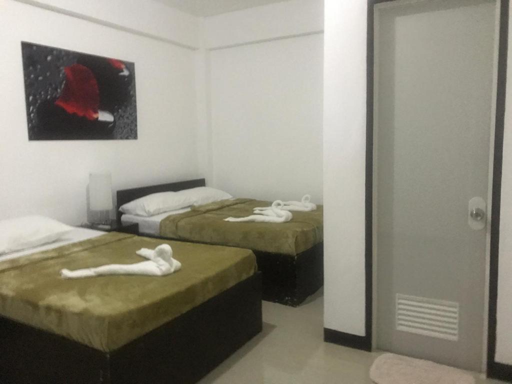 Postel nebo postele na pokoji v ubytování 4C's Tourist Lodge