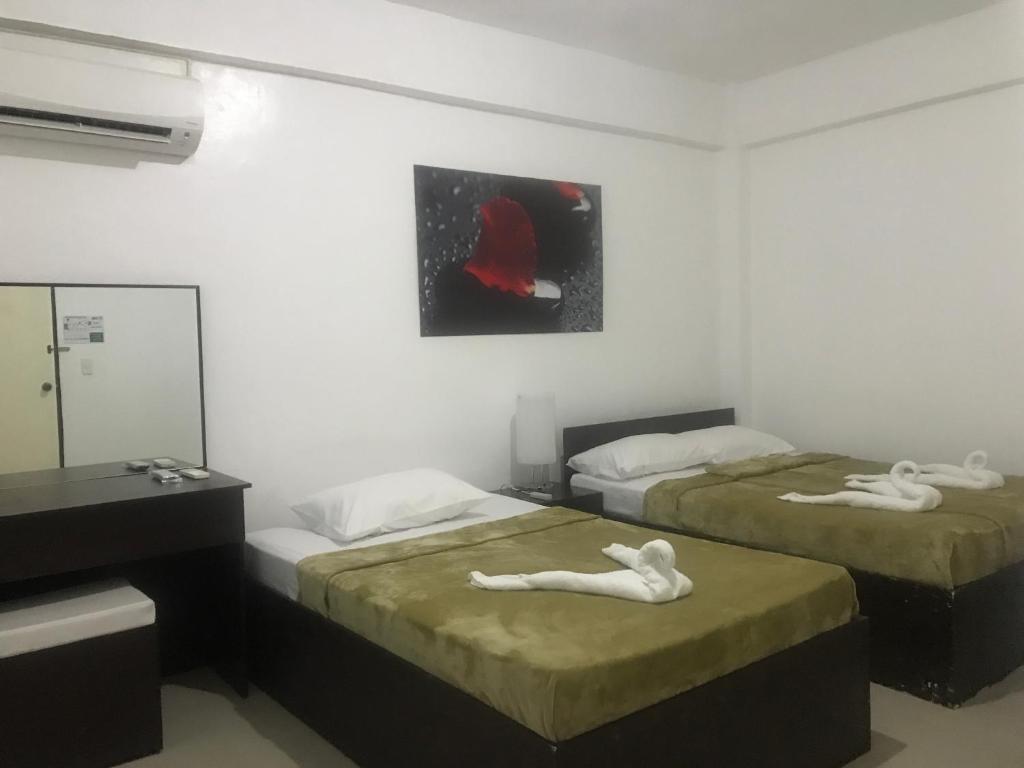Postel nebo postele na pokoji v ubytování 4C's Tourist Lodge