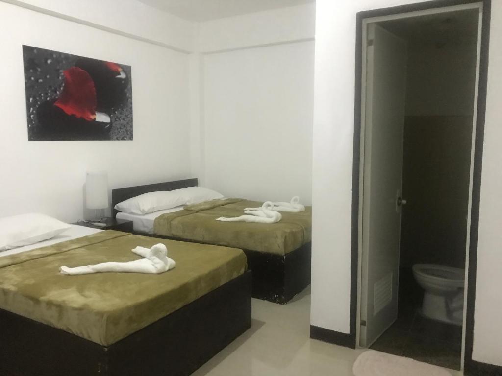 Postel nebo postele na pokoji v ubytování 4C's Tourist Lodge
