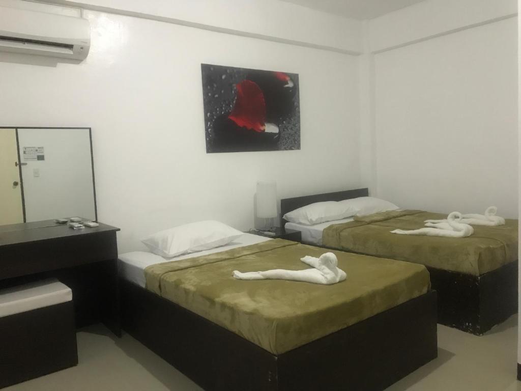 Postel nebo postele na pokoji v ubytování 4C's Tourist Lodge