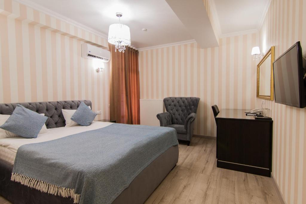 Postel nebo postele na pokoji v ubytování Klassik Hotel